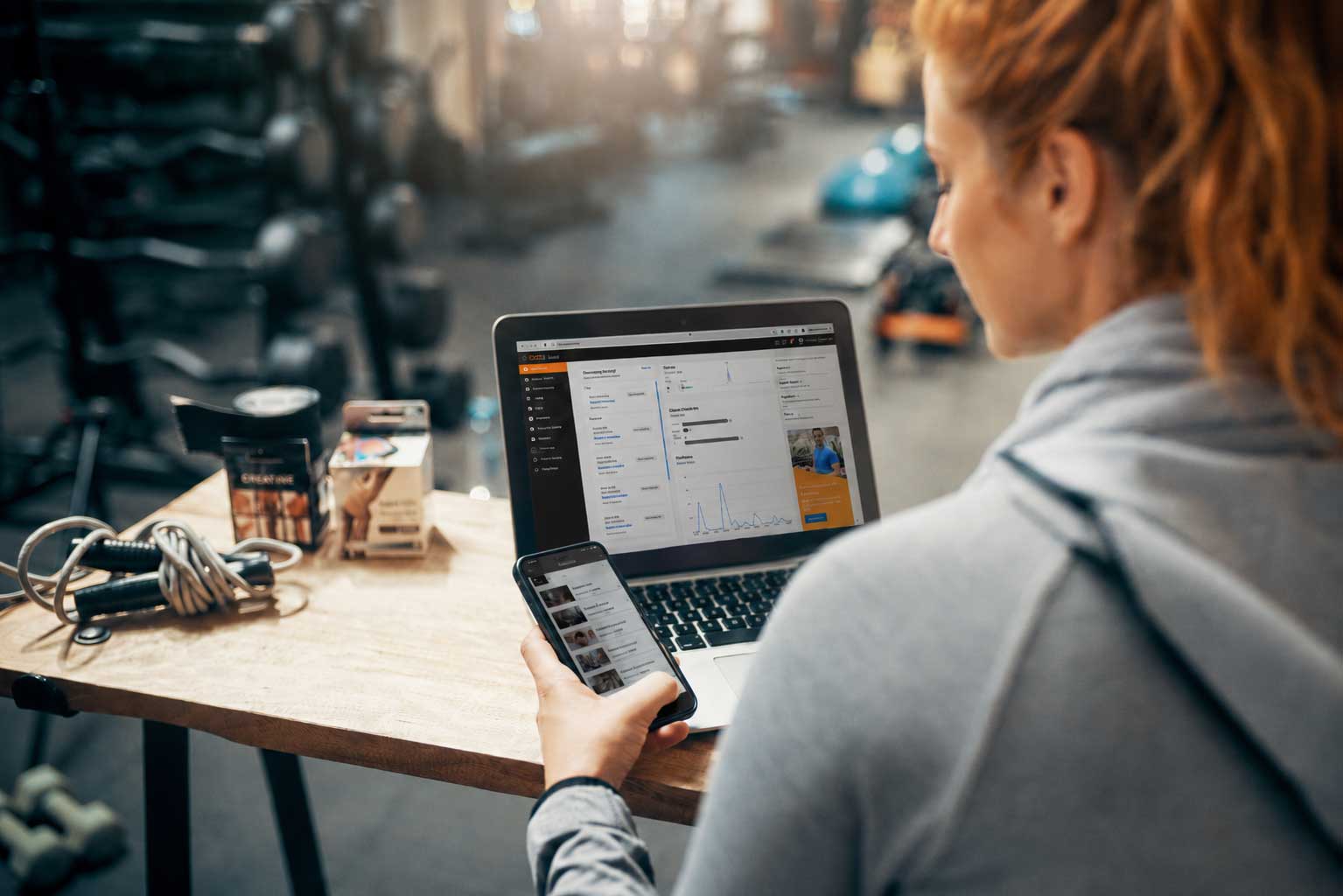 fibodo platform dashboard on laptop with focused trainer